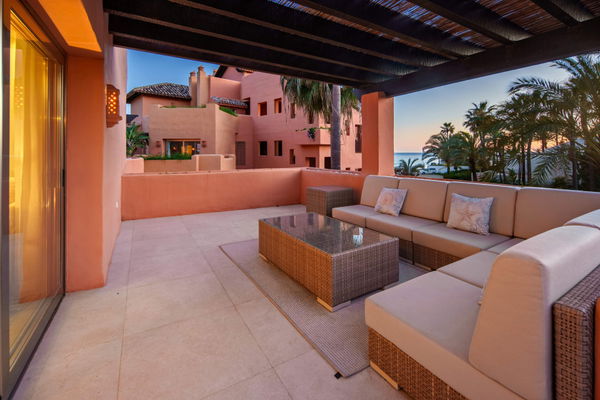 A beachfront penthouse designed around privacy and mediterranean living in La Morera, Marbella East
