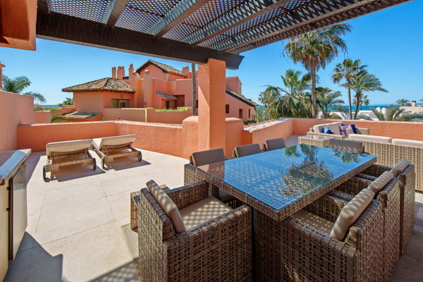 A beachfront penthouse designed around privacy and mediterranean living in La Morera, Marbella East