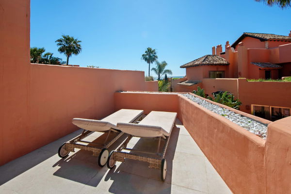 A beachfront penthouse designed around privacy and mediterranean living in La Morera, Marbella East